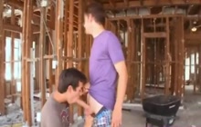 Twink gives blowjob on construction site